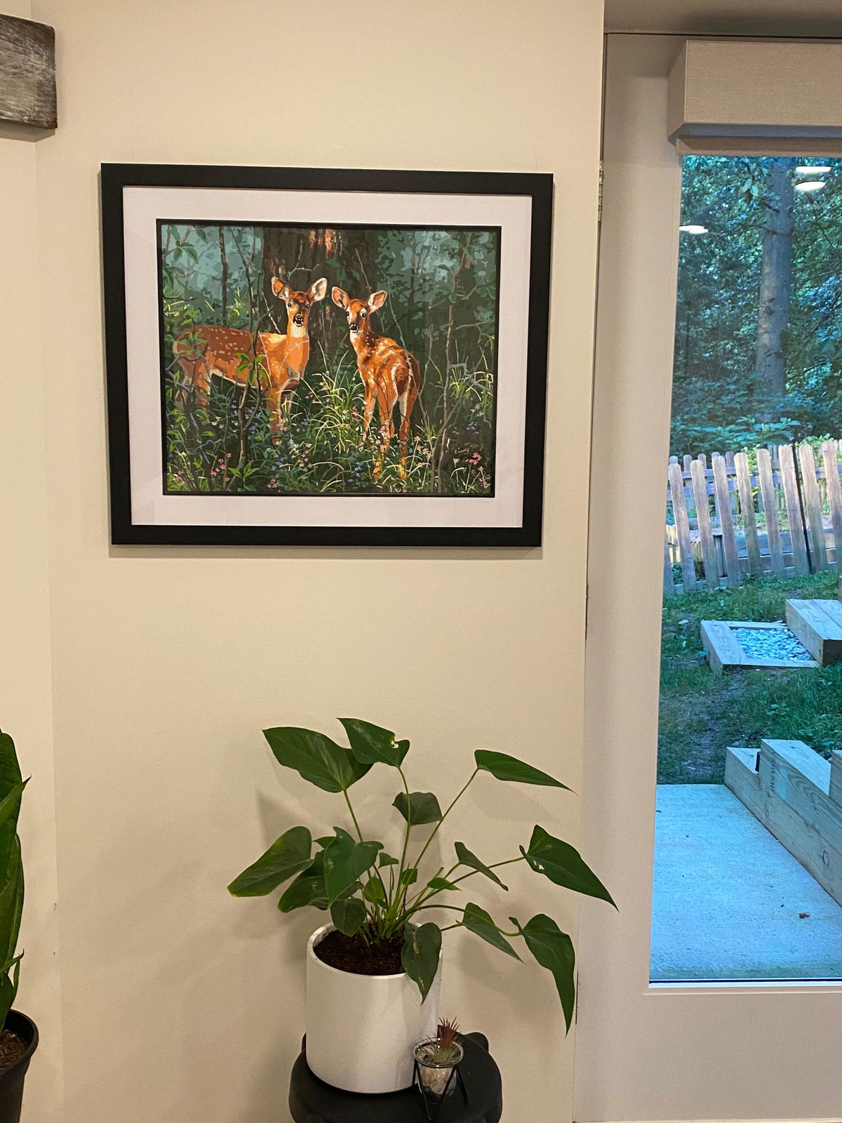 Cissy's finished Twins paint by numbers painting, framed on her wall